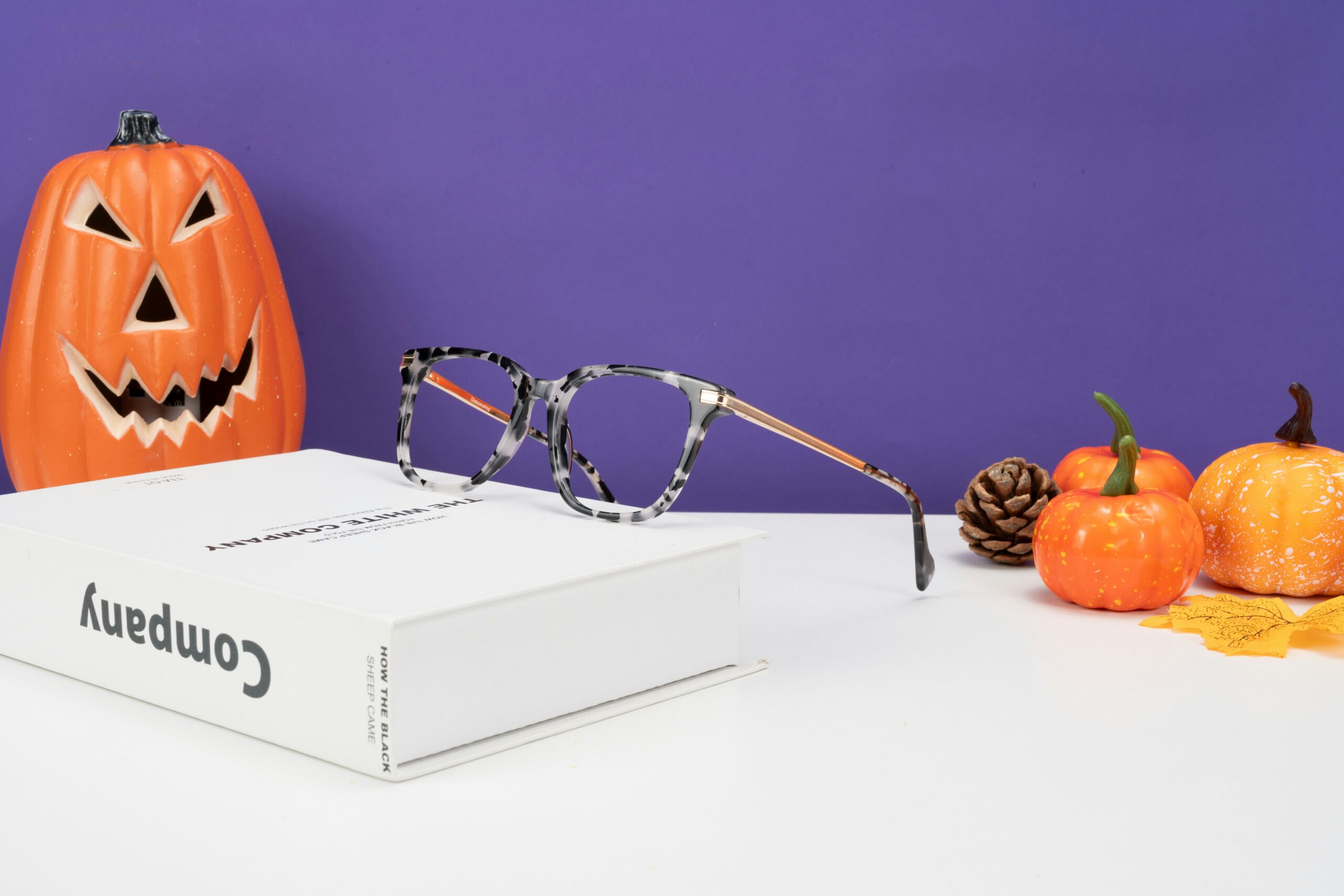 A pair of glasses sitting on top of a box